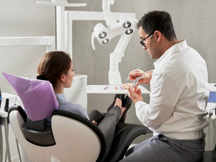 Dentist asks a woman to choose the tooth