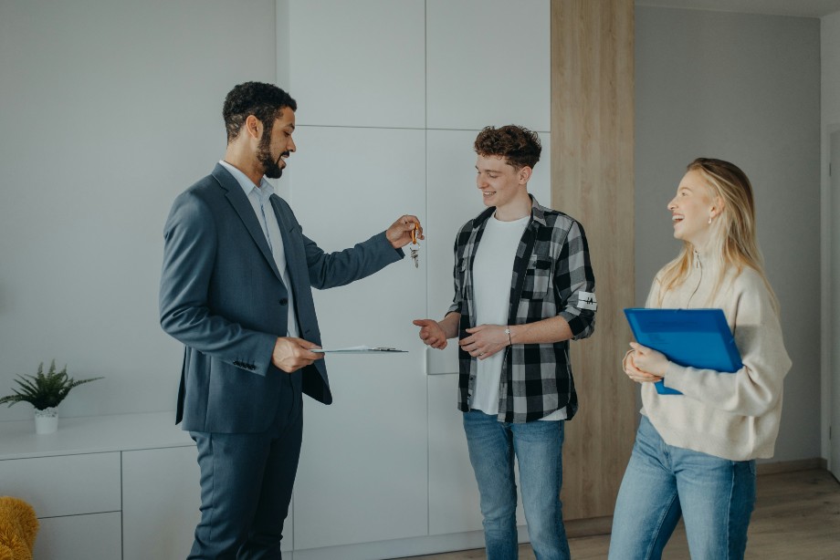 Realtor gives the house key to the buyer