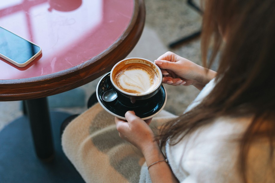 a woman with a cup of coffee