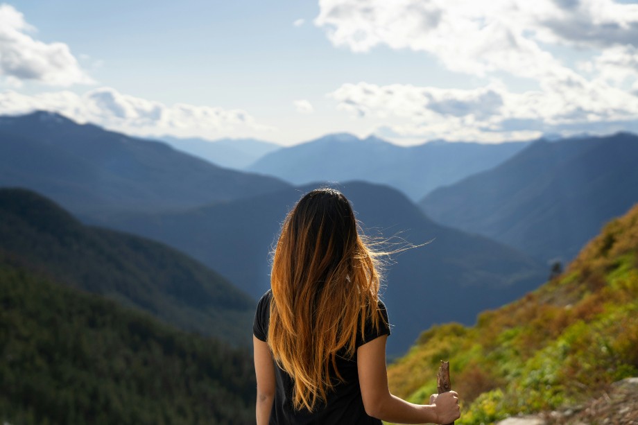 Girl overlooking mountain range

