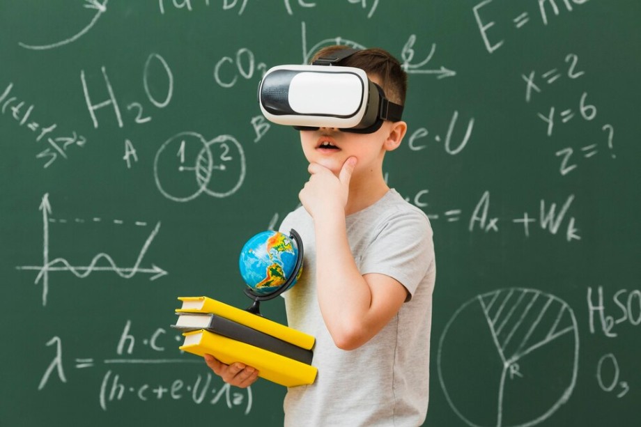 Group of multiethnic kids wearing VR headsets and teacher watching them