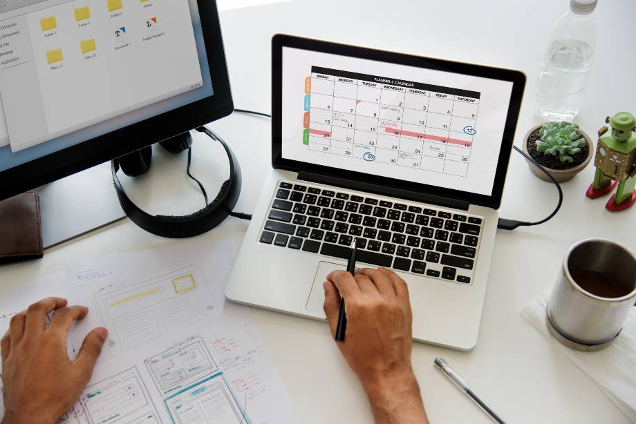 A professional organizing a calendar