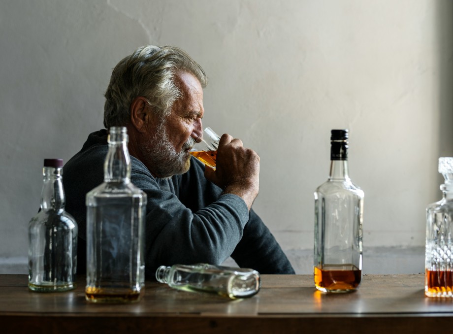 an old man is drinking